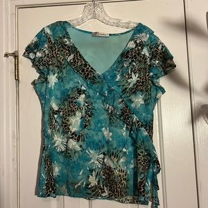 Dressbarn, size large turquoise lace blouse with animal print is fully lined.